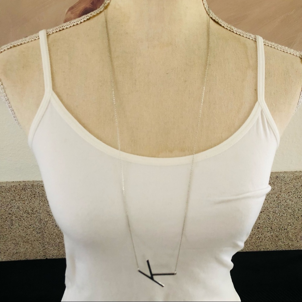 Monogram initial “K” pendant on delicate silver chain necklace